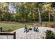 Cozy fire pit area with seating on a brick patio at 4028 Gnarled Oaks Ln, Johns Island, SC 29455