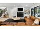 Spacious basement with leather sectional, fireplace, and large TV at 4028 Gnarled Oaks Ln, Johns Island, SC 29455