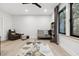 Bright Bedroom features a crib, armchair, and large window at 4028 Gnarled Oaks Ln, Johns Island, SC 29455