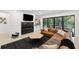 Modern basement living space featuring a fireplace and outdoor access at 4028 Gnarled Oaks Ln, Johns Island, SC 29455
