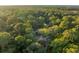 House nestled in a wooded area with a pond nearby at 4028 Gnarled Oaks Ln, Johns Island, SC 29455
