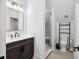 Clean bathroom with a shower, toilet, and vanity with dark cabinets at 4028 Gnarled Oaks Ln, Johns Island, SC 29455