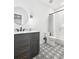 Modern bathroom with gray vanity, marble countertop, and patterned floor at 4028 Gnarled Oaks Ln, Johns Island, SC 29455