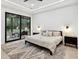Spacious bedroom with sliding doors to backyard, a king bed, and a wood dresser at 4028 Gnarled Oaks Ln, Johns Island, SC 29455