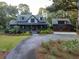 Two-story home with attached garage and landscaped yard at 4028 Gnarled Oaks Ln, Johns Island, SC 29455