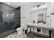Bathroom with dark tile shower, floating vanity, and patterned floor at 4028 Gnarled Oaks Ln, Johns Island, SC 29455