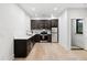 Modern kitchen with dark cabinetry, stainless steel appliances, and quartz countertops at 4028 Gnarled Oaks Ln, Johns Island, SC 29455
