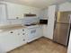 White kitchen with stainless steel appliances at 3034 Maybank Hwy, Johns Island, SC 29455