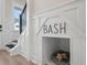 Built-in dog house niche in entryway with modern staircase and wood floors at 345 Bremerton Dr, Goose Creek, SC 29445