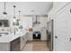 Modern white kitchen with stainless steel appliances and an island at 345 Bremerton Dr, Goose Creek, SC 29445
