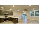 Open living room and kitchen with wood-look floors and access to a patio at 345 Bremerton Dr, Goose Creek, SC 29445