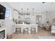 Modern kitchen island with seating, open to living and dining areas at 345 Bremerton Dr, Goose Creek, SC 29445