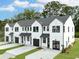 Exterior view of modern townhouses with white siding and black trim at 345 Bremerton Dr, Goose Creek, SC 29445