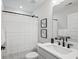 Small bathroom with white vanity, gray cabinets, and a shower/tub combo at 345 Bremerton Dr, Goose Creek, SC 29445