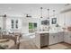 Open concept kitchen with island, stainless steel appliances, and living room view at 345 Bremerton Dr, Goose Creek, SC 29445
