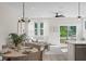 Bright dining area with round table, access to back patio, and open concept floorplan at 345 Bremerton Dr, Goose Creek, SC 29445