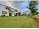 Large backyard with grassy area and screened porch at 345 Bremerton Dr, Goose Creek, SC 29445
