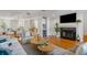 Living room with hardwood floors, fireplace and open concept view of dining area and kitchen at 1665 A Marsh Harbor Ln, Mount Pleasant, SC 29464