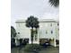 Two-story building with light blue siding and parking underneath at 1665 A Marsh Harbor Ln, Mount Pleasant, SC 29464