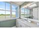 Bathroom with water view, double vanity, and updated fixtures at 1665 A Marsh Harbor Ln, Mount Pleasant, SC 29464