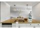 Modern kitchen with granite countertops, stainless steel sink, and white cabinets at 1665 A Marsh Harbor Ln, Mount Pleasant, SC 29464