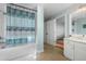 Bathroom with tub shower combination and updated vanity at 1665 A Marsh Harbor Ln, Mount Pleasant, SC 29464