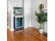 Built-in wine refrigerator in a dedicated alcove with hardwood floors at 1665 A Marsh Harbor Ln, Mount Pleasant, SC 29464