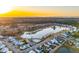 Aerial view of a lakefront community at sunset at 3885 Summerton St, Mount Pleasant, SC 29466