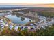 Aerial view of a lakefront community with homes surrounding the lake at 3885 Summerton St, Mount Pleasant, SC 29466