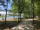 Scenic walking trail through lush trees, leading to a lake at 3890 Summerton St, Mount Pleasant, SC 29466