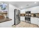 Modern kitchen with stainless steel appliances and white cabinetry at 1111 Summerwind Lane, Seabrook Island, SC 29455