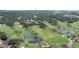 Aerial view of a scenic golf course with ponds and meticulously manicured greens at 1111 Summerwind Lane, Seabrook Island, SC 29455