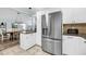 Modern kitchen with stainless steel appliances and an island with seating at 1111 Summerwind Lane, Seabrook Island, SC 29455