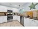 Modern kitchen with stainless steel appliances and white cabinetry at 1111 Summerwind Lane, Seabrook Island, SC 29455