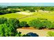 Aerial view of expansive equestrian facility with riding arenas and paddocks at 1111 Summerwind Lane, Seabrook Island, SC 29455