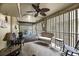 Inviting covered porch features wicker furniture and ceiling fan at 1111 Summerwind Lane, Seabrook Island, SC 29455