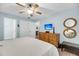 Spacious bedroom featuring a king-size bed, dresser, and access to the bathroom at 1111 Summerwind Lane, Seabrook Island, SC 29455