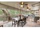Relaxing screened porch with seating area and dining table at 1111 Summerwind Lane, Seabrook Island, SC 29455