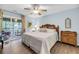 Main bedroom with a king-size bed, access to a private balcony, and an ensuite bathroom at 1111 Summerwind Lane, Seabrook Island, SC 29455