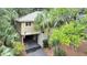 Aerial view of a house showcasing its location and driveway at 1111 Summerwind Lane, Seabrook Island, SC 29455