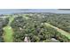 Aerial view showing homes surrounded by a lush golf course at 1111 Summerwind Lane, Seabrook Island, SC 29455