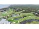 Aerial view highlighting a golf course community near the coast at 1111 Summerwind Lane, Seabrook Island, SC 29455