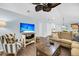Living room with comfortable seating, a TV, and hardwood floors at 1111 Summerwind Lane, Seabrook Island, SC 29455