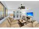 Living room with sectional sofa, French doors, and hardwood floors at 1111 Summerwind Lane, Seabrook Island, SC 29455