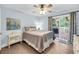 Cozy bedroom with a full-size bed and access to a private deck at 1111 Summerwind Lane, Seabrook Island, SC 29455