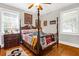 Charming bedroom with hardwood floors, a four-poster bed, and ample natural light at 925 Center St, Mount Pleasant, SC 29464