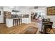 Open kitchen with white cabinets, granite countertops, and a breakfast bar at 925 Center St, Mount Pleasant, SC 29464