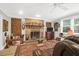 Living room with brick fireplace, hardwood floors, and comfortable seating at 925 Center St, Mount Pleasant, SC 29464