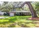 Brick ranch home with large tree and swing at 925 Center St, Mount Pleasant, SC 29464