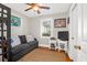 Small bedroom with hardwood floors, sofa, and TV at 925 Center St, Mount Pleasant, SC 29464